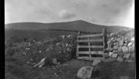 Object Photograph of a wooden field gate and stone wall between Roundwood and Enniskerry, Co. Wicklow; Djouce in backgroundcover picture