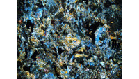 Object ISAP 04451, photograph of cross polarised thin section of stone axecover picture