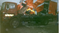 Object Side portion of a severely damaged Jacob's truckhas no cover picture