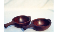 Object Two bowls with handles in dark wood designed by Jimmy Holohanhas no cover picture