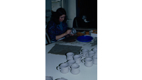 Object Woman at work in ceramics departmenthas no cover