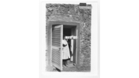 Object Woman with tray of pots in doorway of ceramics departmenthas no cover picture