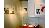 Object Display of graphic design and books in glass casescover picture