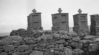 Object Untitled [Stone wall, rectangular tombs with crosses on top in background]cover