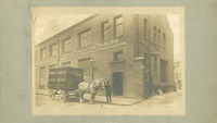 Object Man standing with horse and cart outside of London warehousecover picture