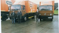 Object Three men standing beside Jacob's delivery truckscover