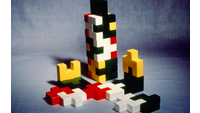 Object Toy building blocks in red, green, yellow, black and red designed by Gerald Tylerhas no cover