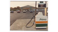 Object Close up of petrol pump with garage in backgroundhas no cover picture