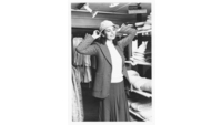 Object Woman trying on hat in fashion departmenthas no cover picture