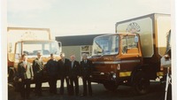 Object Men standing beside some Boland's Biscuits truckscover picture