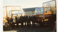 Object Group of men standing beside Boland's Biscuits truckscover