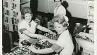 Object Three female workers packing boxes of ginger nut biscuitscover picture