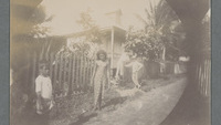 Object Photograph of a Samoan child, young woman, and two men posing outside a house in Apia, Samoacover picture