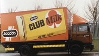 Object Orange Jacob's delivery truck with Club Milk advertisement on its sidehas no cover picture