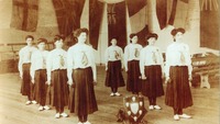 Object Women standing in a sports hall with a shield awardcover