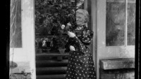 Object Photograph of Mary Helena Synge outside a greenhousehas no cover