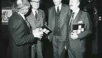 Object Gordon Lambert talking to others at an art exhibitioncover picture