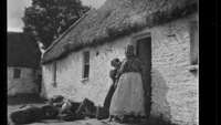 Object Photograph of a woman and a girl, in the doorway of a whitewashed thatched cottage, possibly in Co. Kerryhas no cover